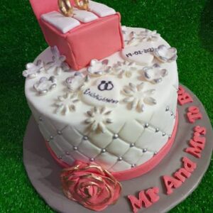 Custom-decorated cake for an engagement or wedding celebration